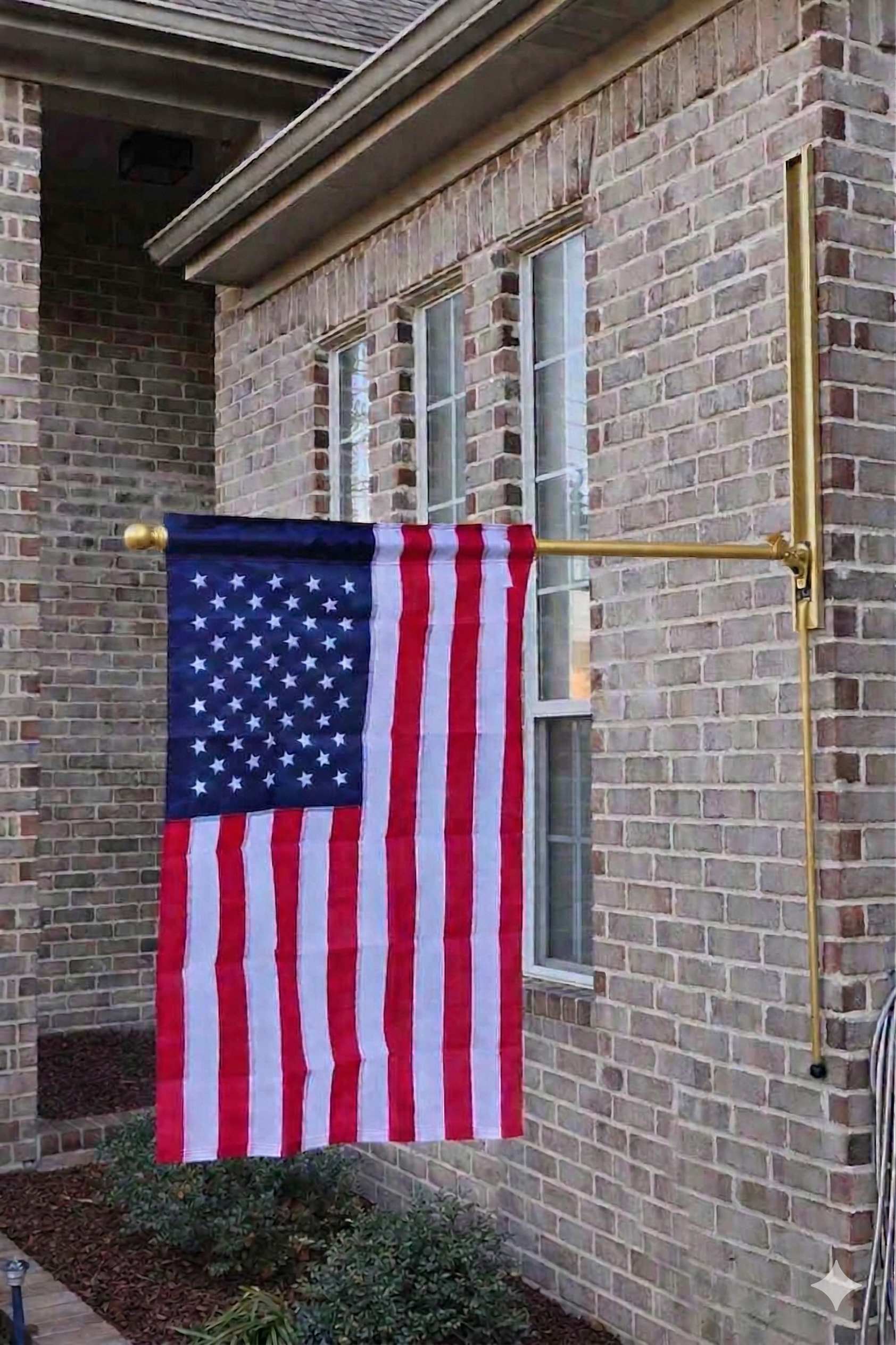 Gold VersaMAST System with American flag in lowered position